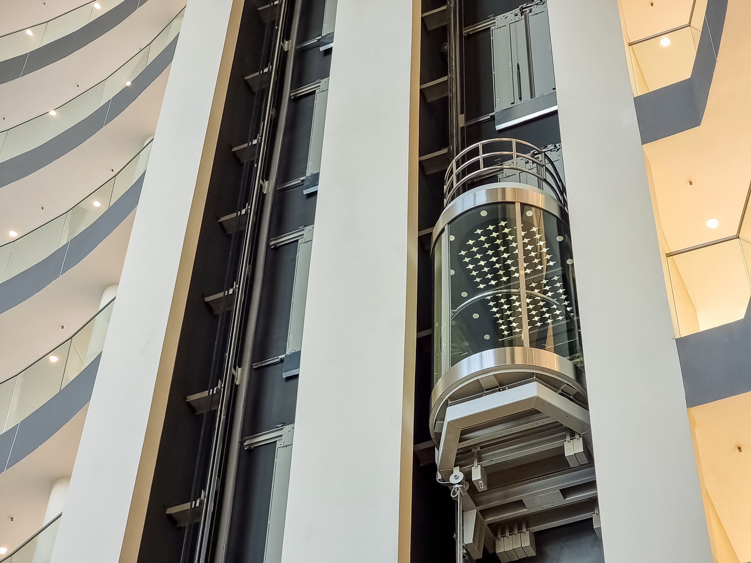 glass capsule elevator ,lift at luxury hotel or building.modern glass elevator to the upper floors, high building ,office and shopping mall